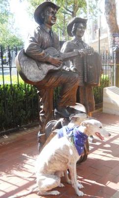 Clancy and Connor with statue of Slim and Joy